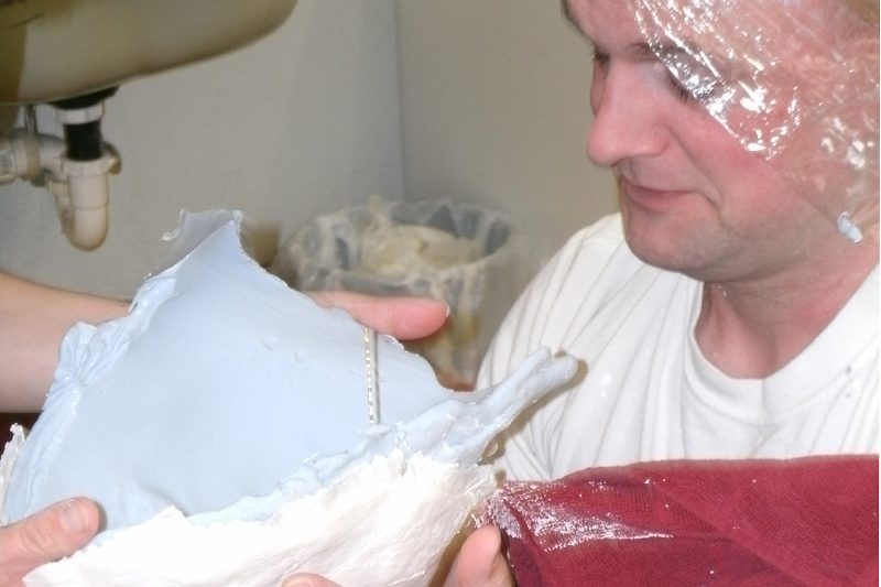 The negative impression of Scott's face is removed and inspected...