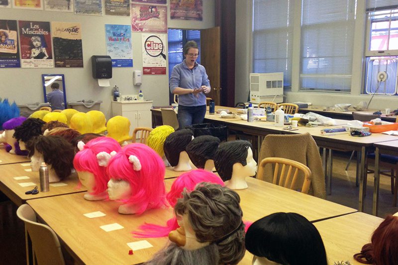Maeve with the wigs for the Shrek production.
